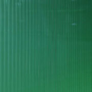 green polycarbonate in perspective view use as background, banner or wallpaper. polycarbonate plastic texture. transparent material corrugated plastic surface use for partition wall or roofing.