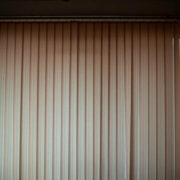 Blinds in room. Window closed from light. Blinds covered light. Interior details.