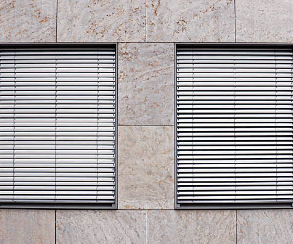 Two windows with silver shutters